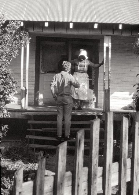 A member of Jim Lemkin’s group meets an African-American woman on her front step to discuss the Voting Rights Act of 1965 and the lifting of voter suppression tactics.