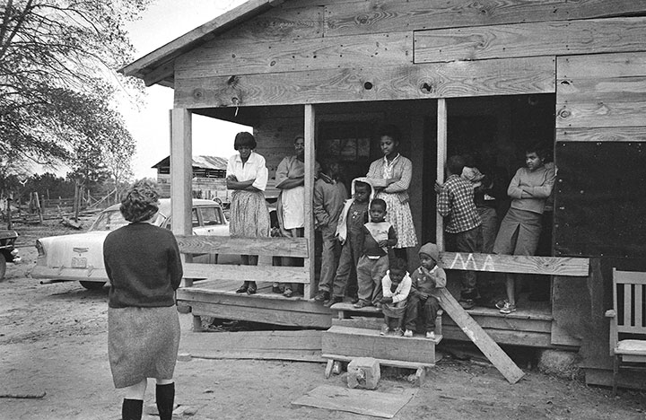 An African-American family in the South gathers to speak with a northern college student about the Mississippi Freedom Christmas – a mission to enroll African-American voters following the Voting Rights Act of 1965.