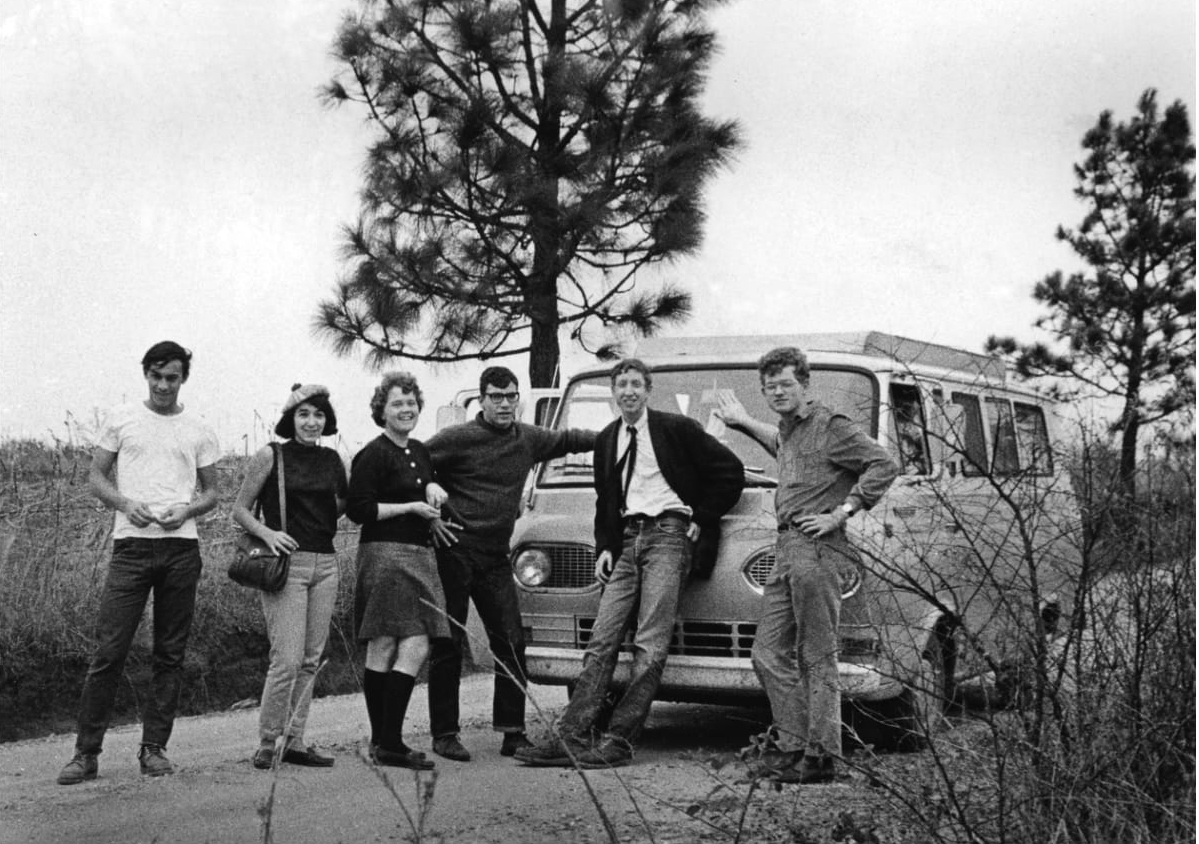 Jim Lemkin, second from the right, and his group pose for a photo in front of the van they drove from New York to Mississippi in 1965.