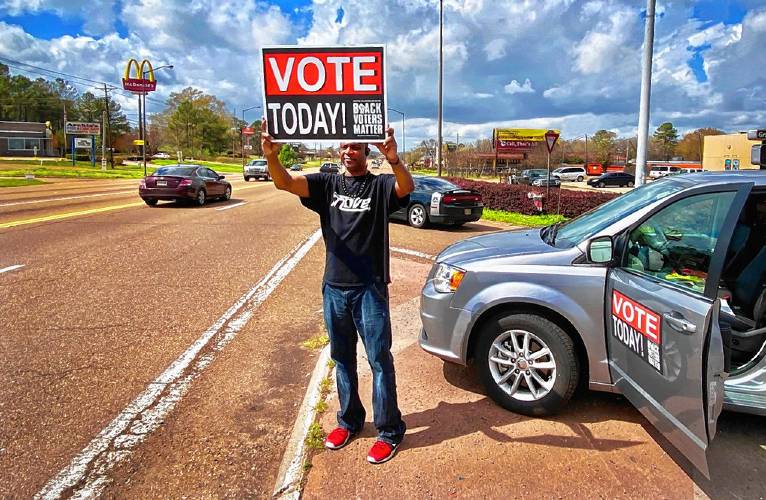 Leonard McCloud, an organizer for Mississippi MOVE, encourages people in the state capital of Jackson to vote on Primary Day in March.  Photo courtesy of Jim Lemkin